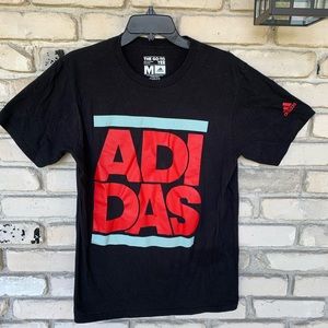 Adidas shirt with big graphic of word adidas